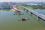 Another 57 meters of the span structure of the bridge over the Ob River is pushed towards the river 