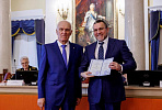 Rector of the St. Petersburg Mining University presents a diploma of Candidate of Economic Sciences to CEO of VIS Group